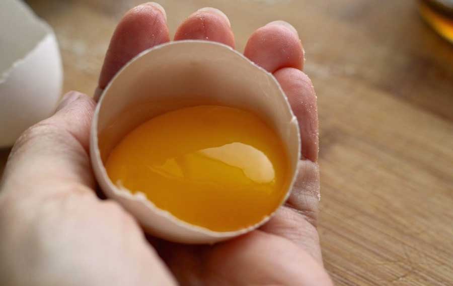 Why is it said that eating a raw egg is dangerous?