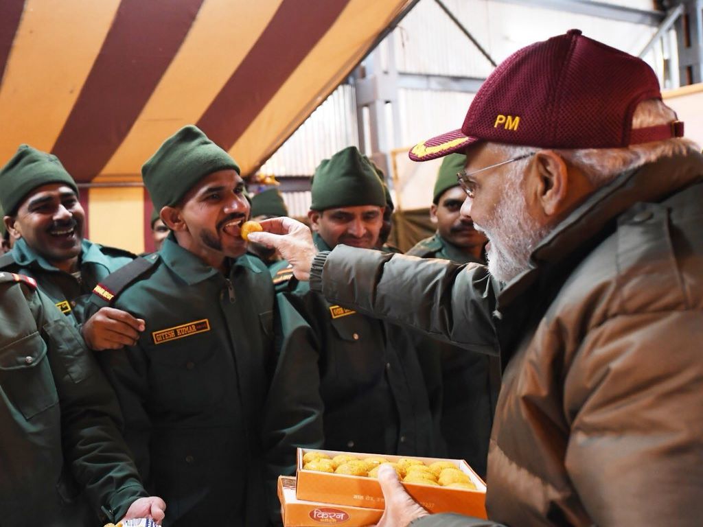 PM Modi distributes sweets to the army personal on the occasion of Diwali.