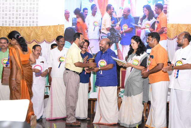T.K.Sunil kumar receiving award from Minister V.S.Sunil kumar